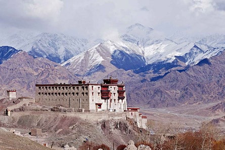 Stok Palace with snow-covered mountains in the background, Ladakh